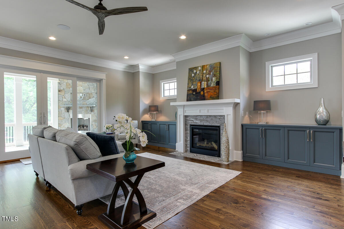 3311 Lake Boone Trail Raleigh, NC 27607 - Photo 3 of 24 a living room with furniture and a fireplace
