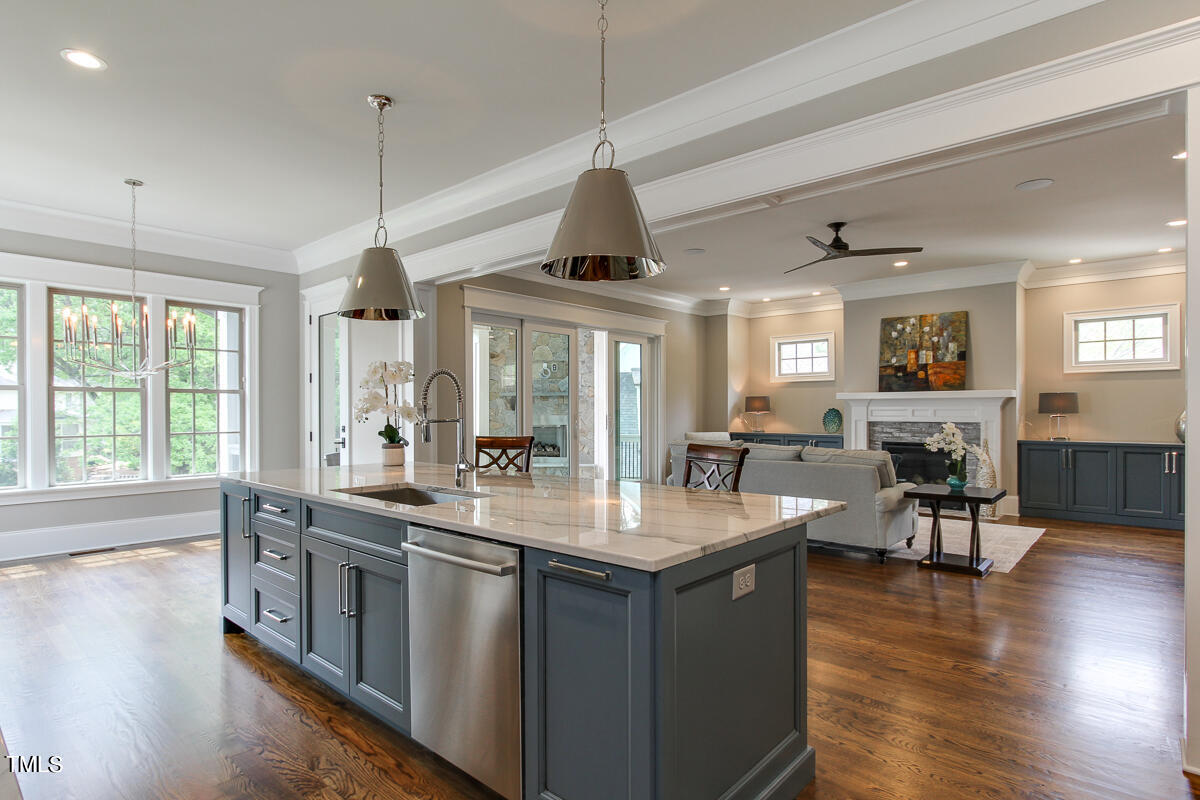 3311 Lake Boone Trail Raleigh, NC 27607 - Photo 8 of 24 a kitchen with stainless steel appliances granite countertop a stove and wooden floor