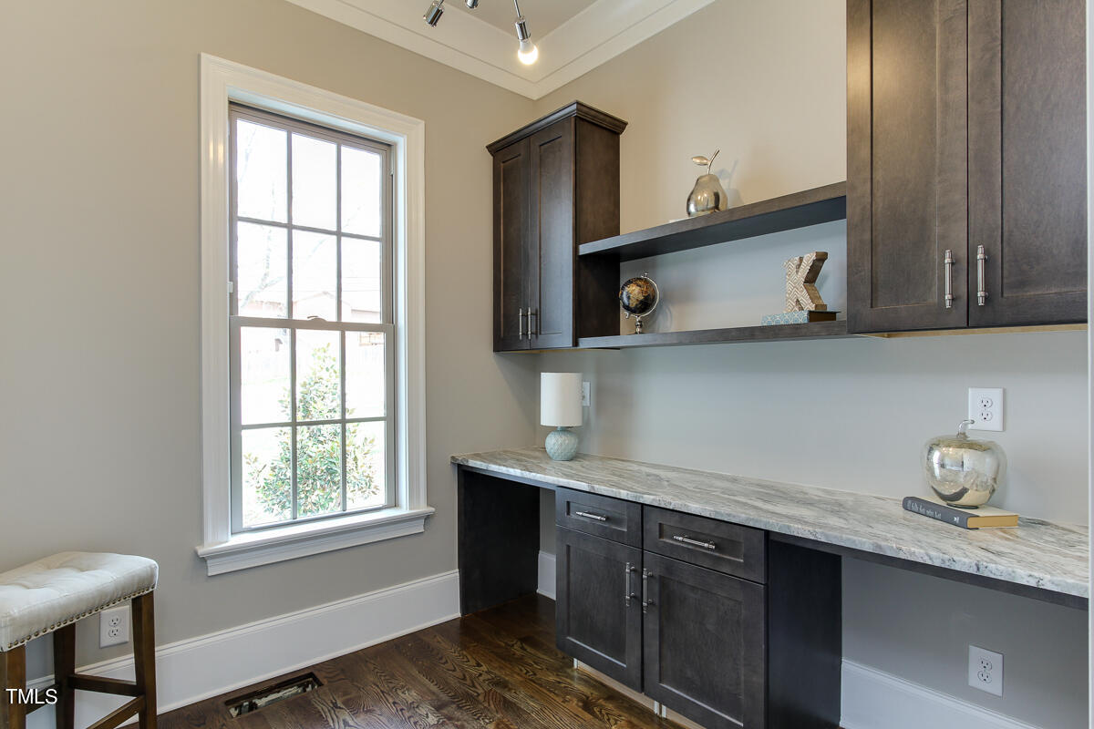 3311 Lake Boone Trail Raleigh, NC 27607 - Photo 9 of 24 a kitchen with stainless steel appliances granite countertop a sink window and cabinets