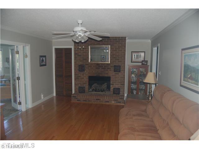 351 Duke Whittaker Road Mocksville, NC 27028 - Photo 11 of 16 Den/Family/Great Room. gas log fireplace, hardwood floors