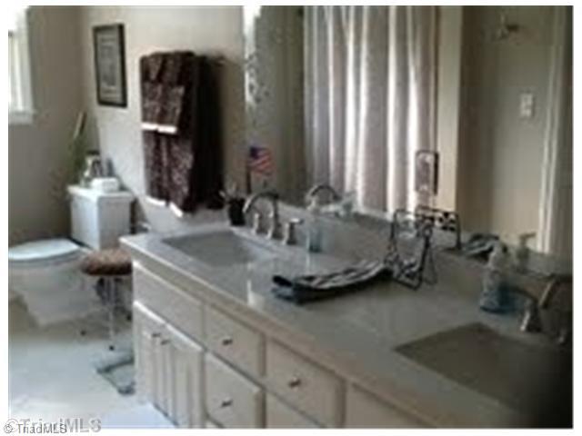 351 Duke Whittaker Road Mocksville, NC 27028 - Photo 15 of 16 Bath. Spacious main bath remodeled with double sinks, new flooring, new light fixtures.