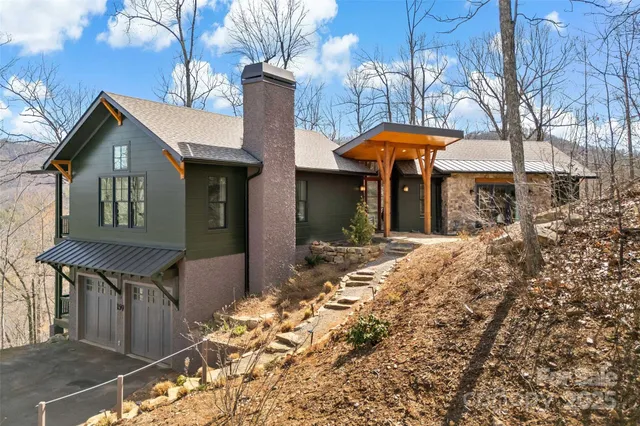 a front view of a house with yard and seating area