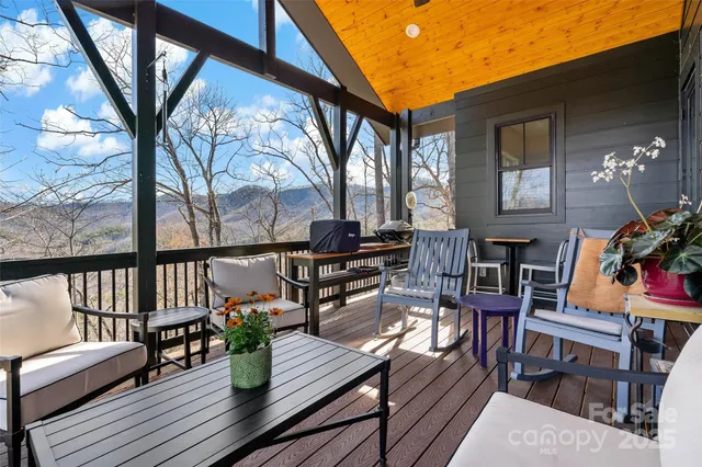 a view of a house with outdoor seating