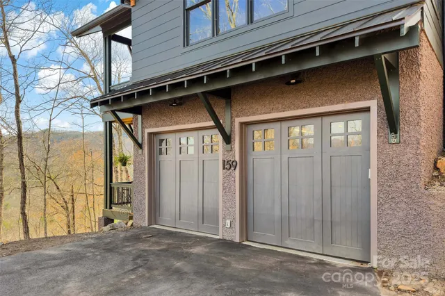 a view of a house with a wooden fence