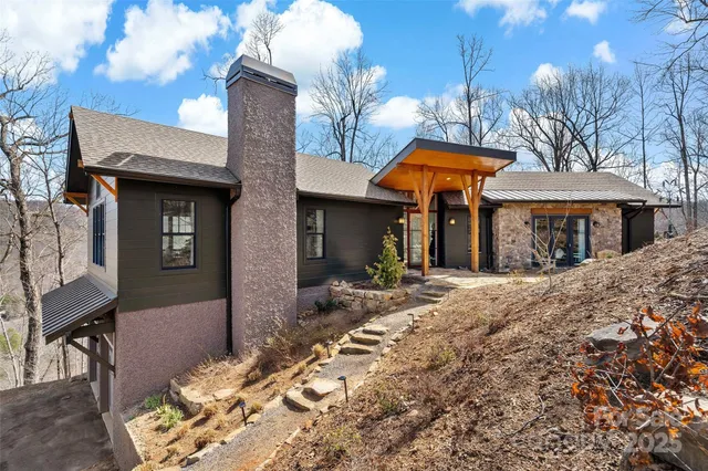 a front view of a house with parking