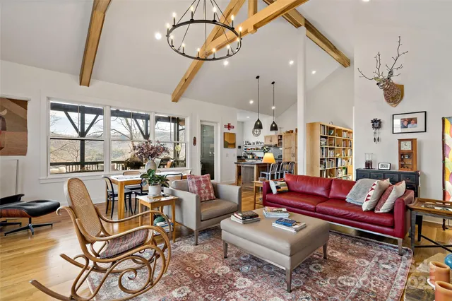 a living room with furniture a rug and a floor