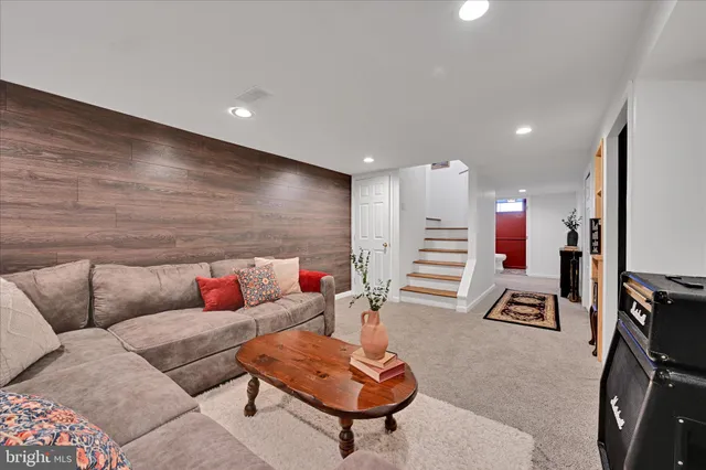 a bedroom with bed and a couch