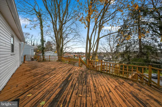 a view of a balcony with wooden floor