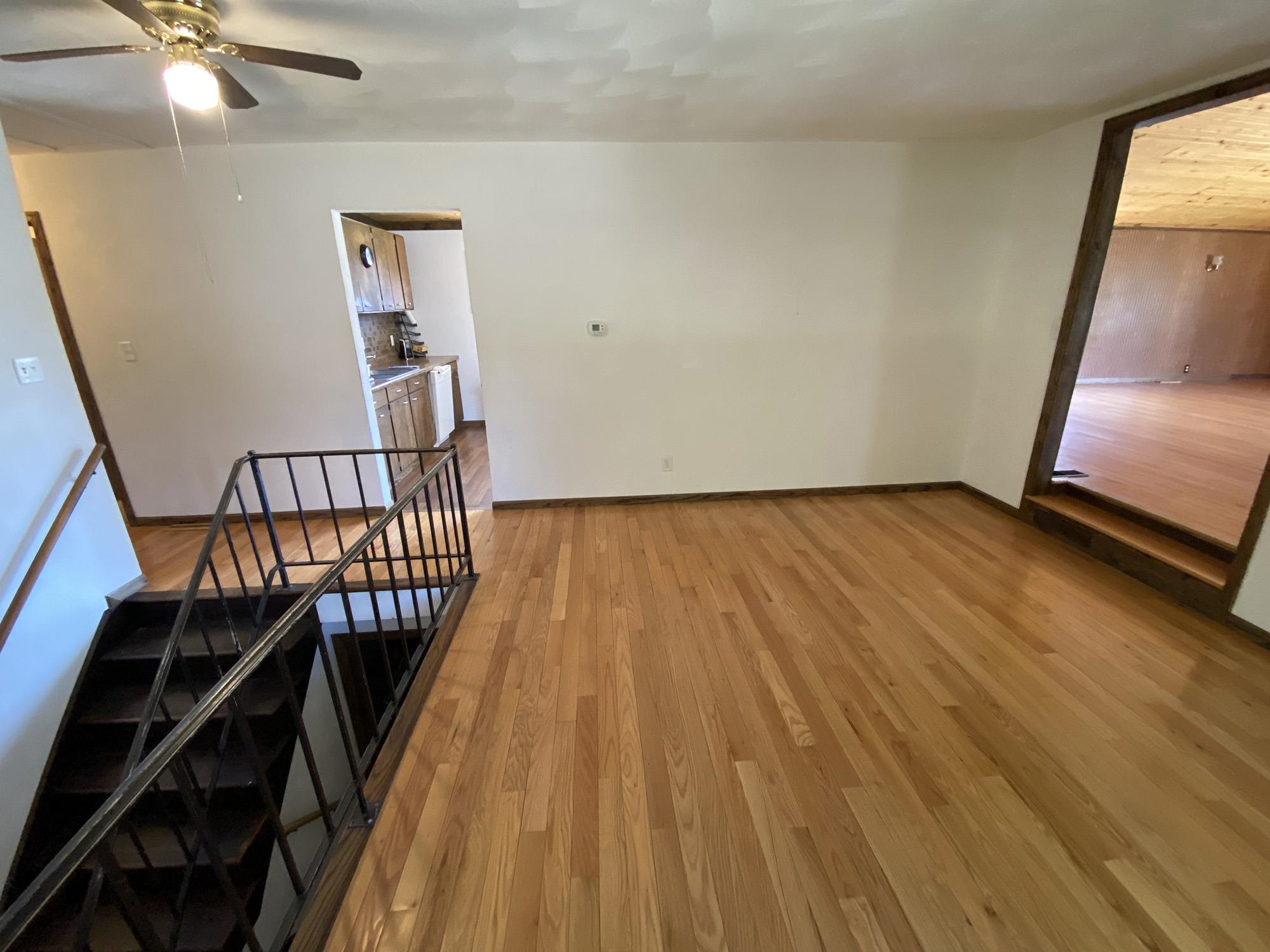 617 South Ridge Street Shannon, IL 61078 - Photo 13 of 30 a view of a hallway with wooden floor and staircase