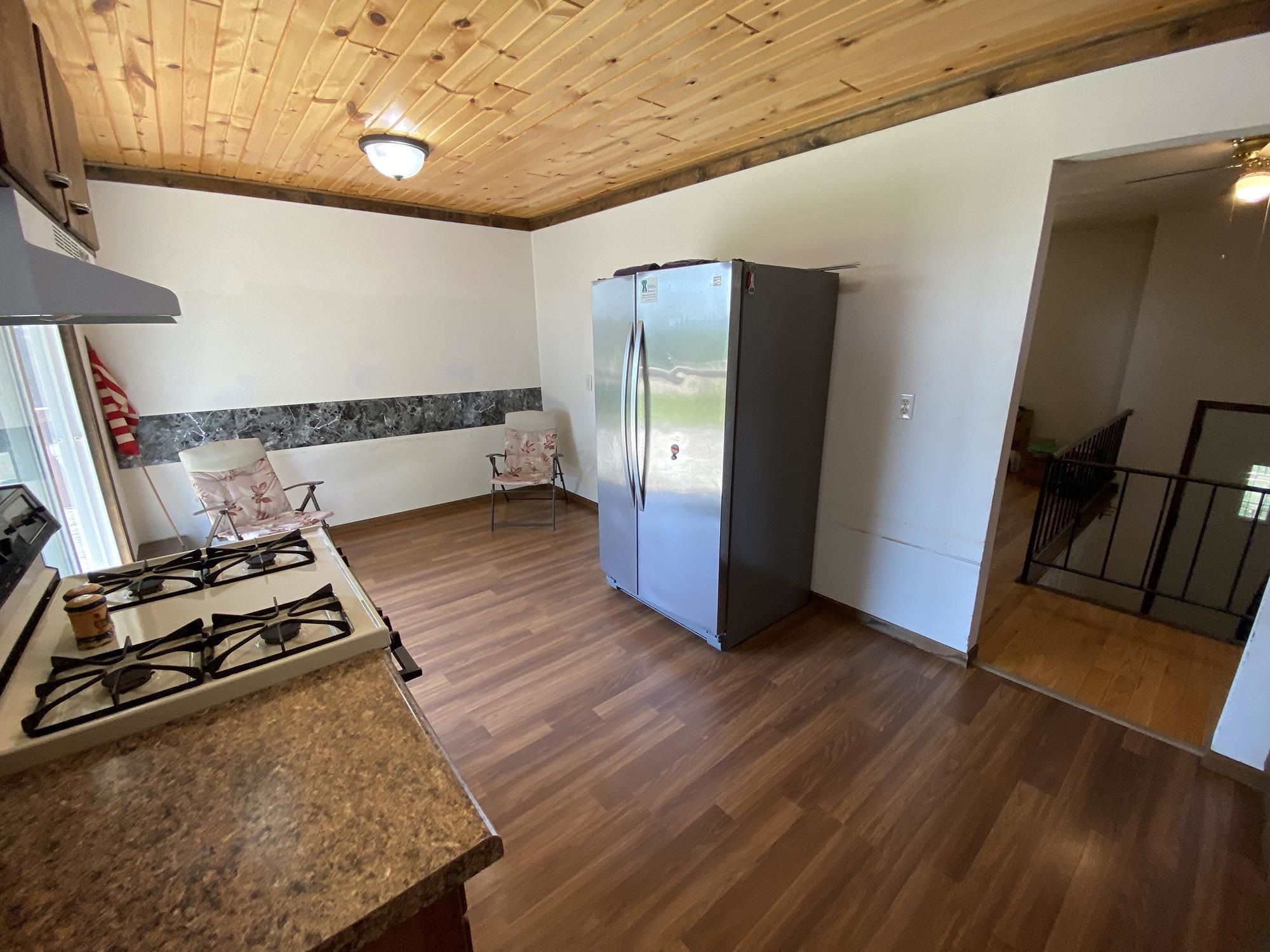 617 South Ridge Street Shannon, IL 61078 - Photo 17 of 30 a view of a room with wooden floor and furniture