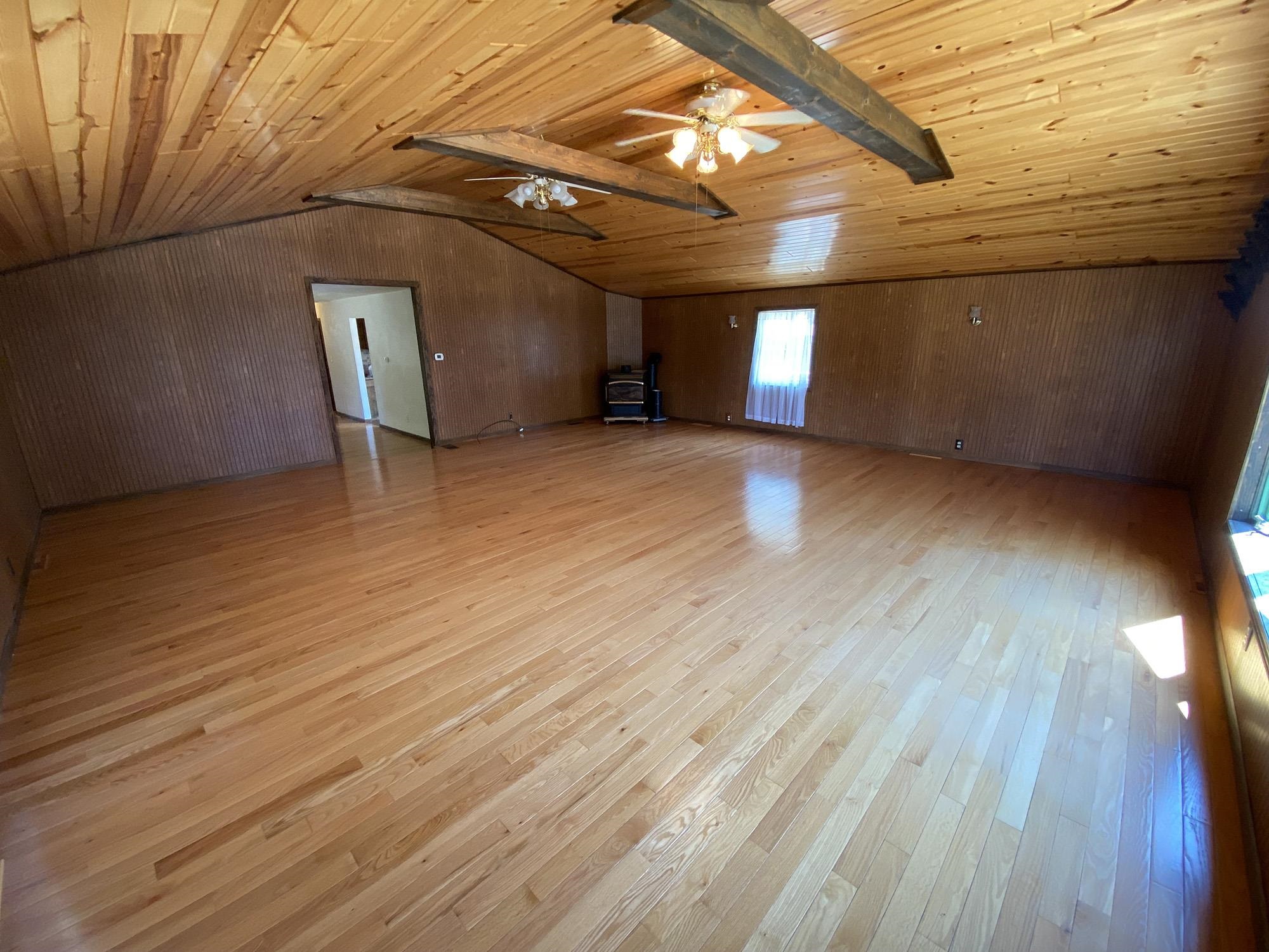 617 South Ridge Street Shannon, IL 61078 - Photo 8 of 30 a view of empty room with wooden floor