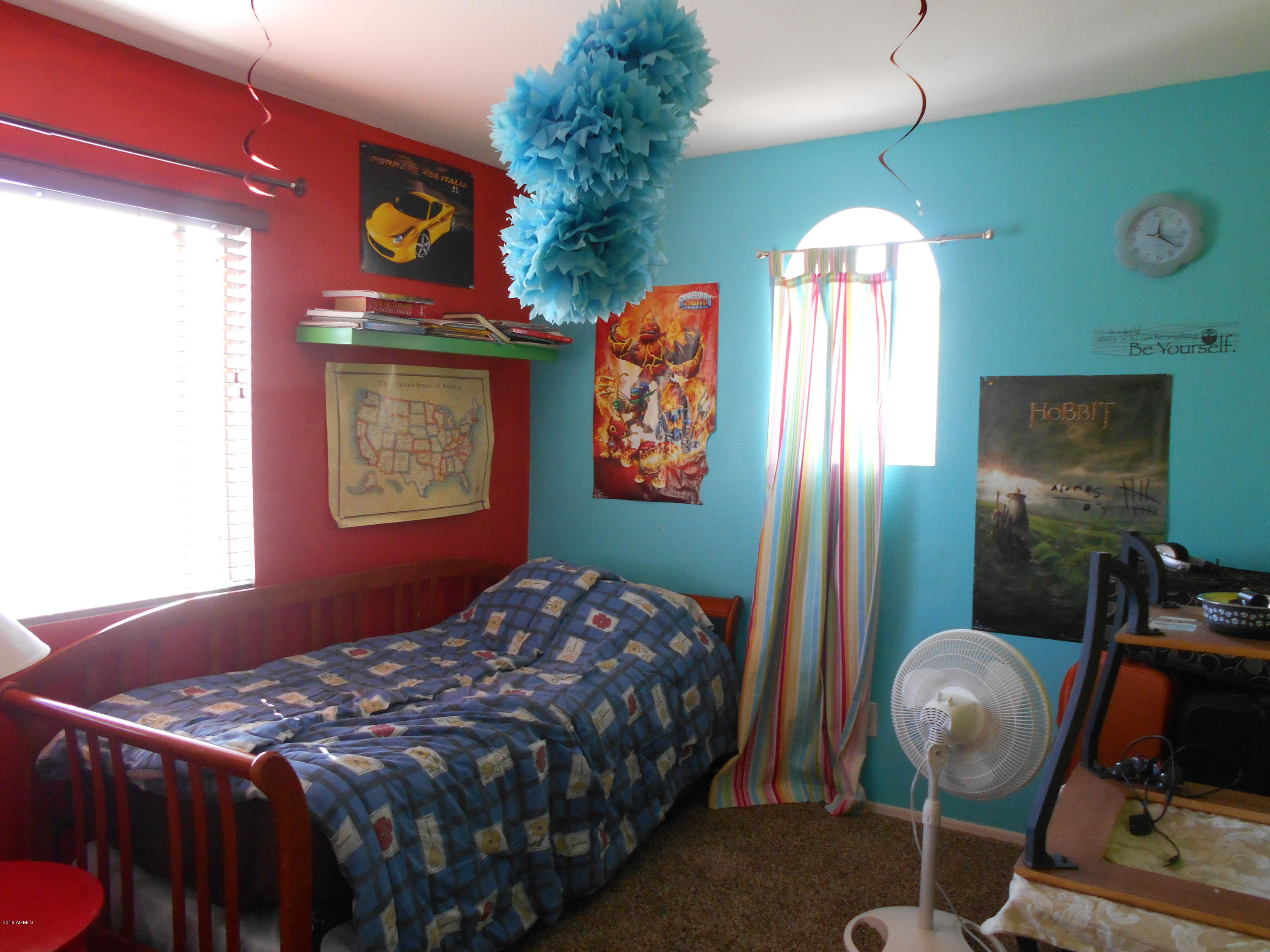 4902 West Tonto Road Glendale, AZ 85308 - Photo 16 of 22 a bedroom with bed and a window