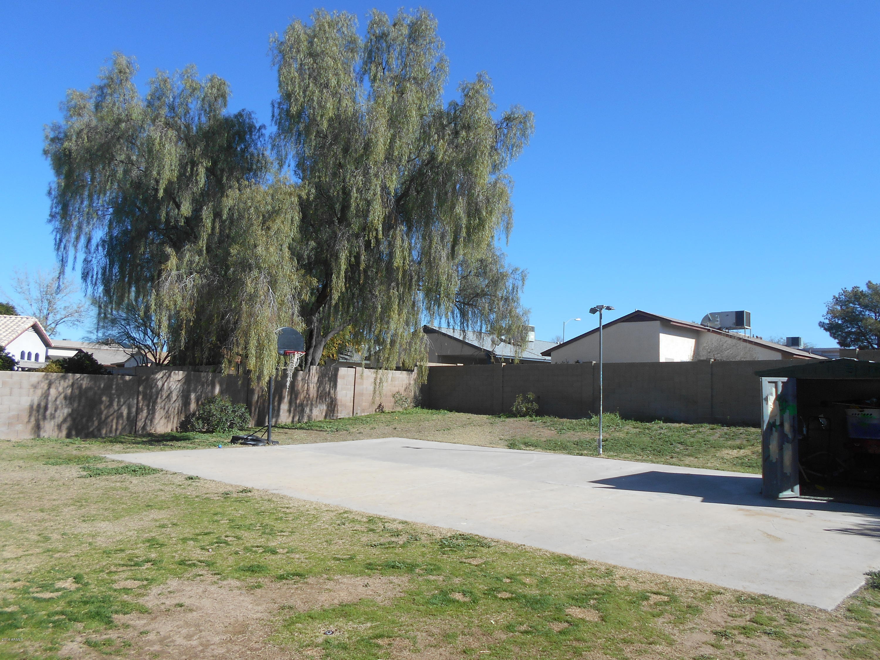 4902 West Tonto Road Glendale, AZ 85308 - Photo 18 of 22 a front view of a house with a yard