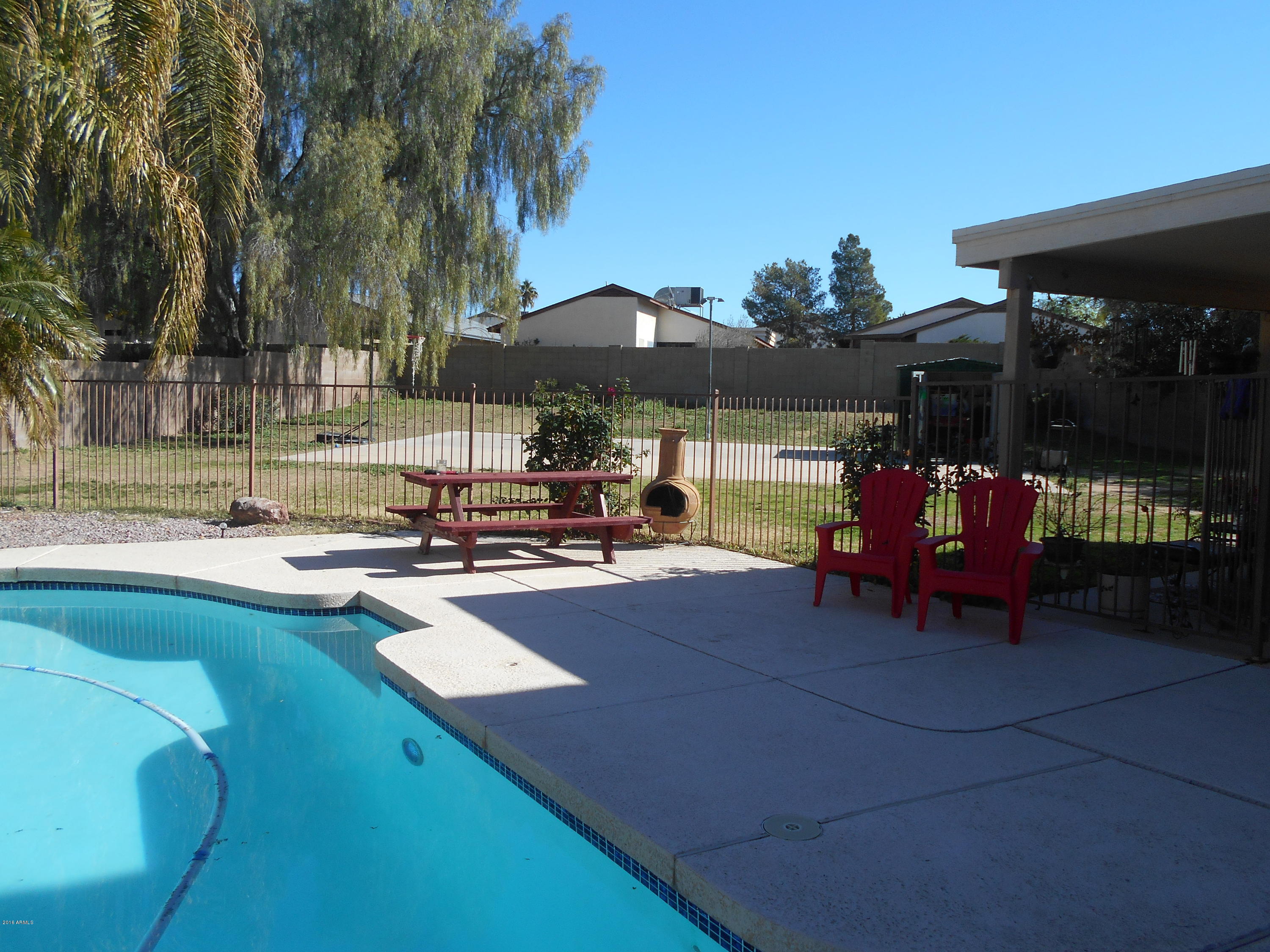 4902 West Tonto Road Glendale, AZ 85308 - Photo 21 of 22 a view of a backyard with sitting area