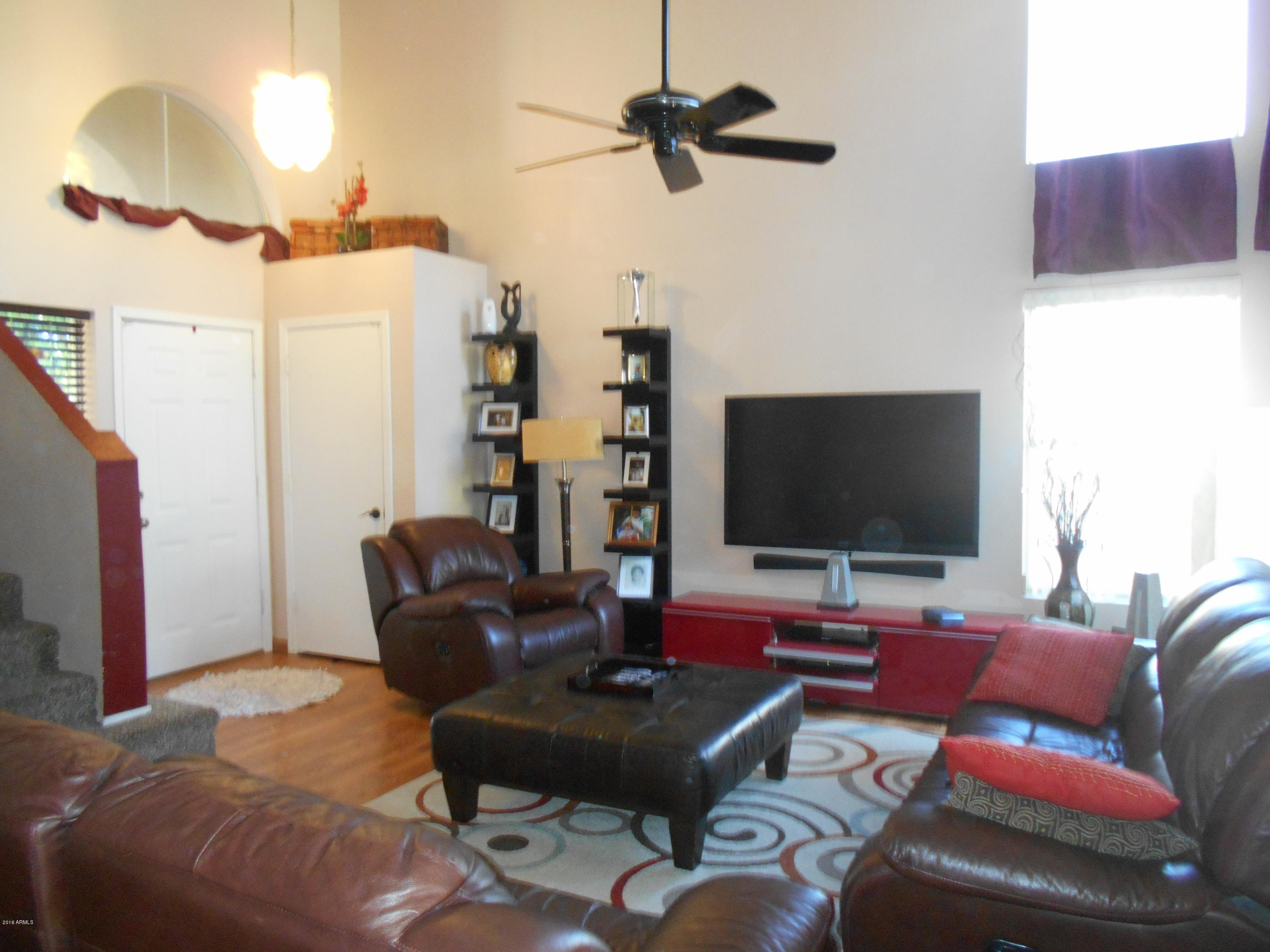 4902 West Tonto Road Glendale, AZ 85308 - Photo 22 of 22 a living room with furniture and a flat screen tv