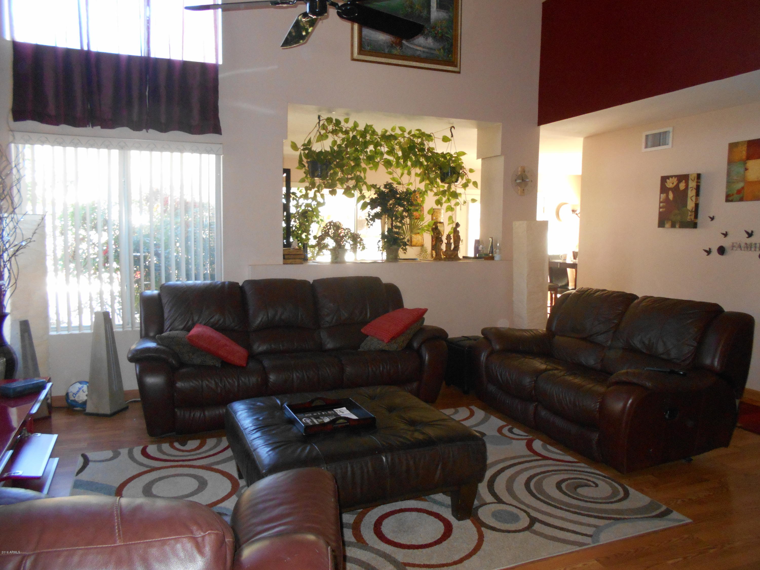 4902 West Tonto Road Glendale, AZ 85308 - Photo 3 of 22 a living room with furniture and a window