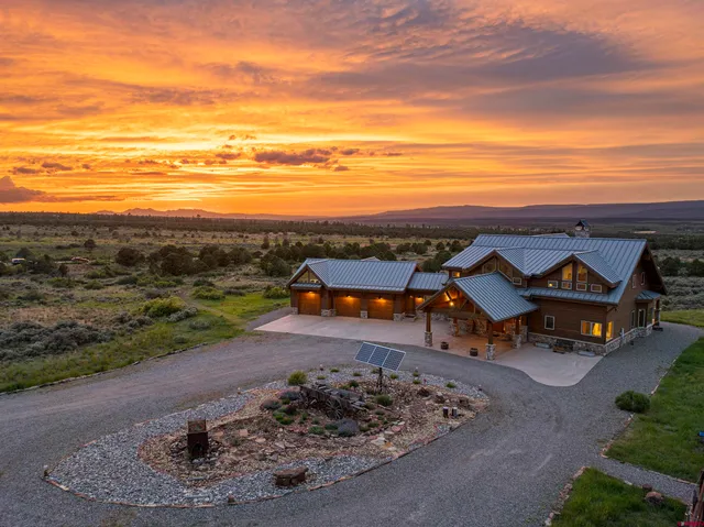 a view of a terrace with a table and chairs