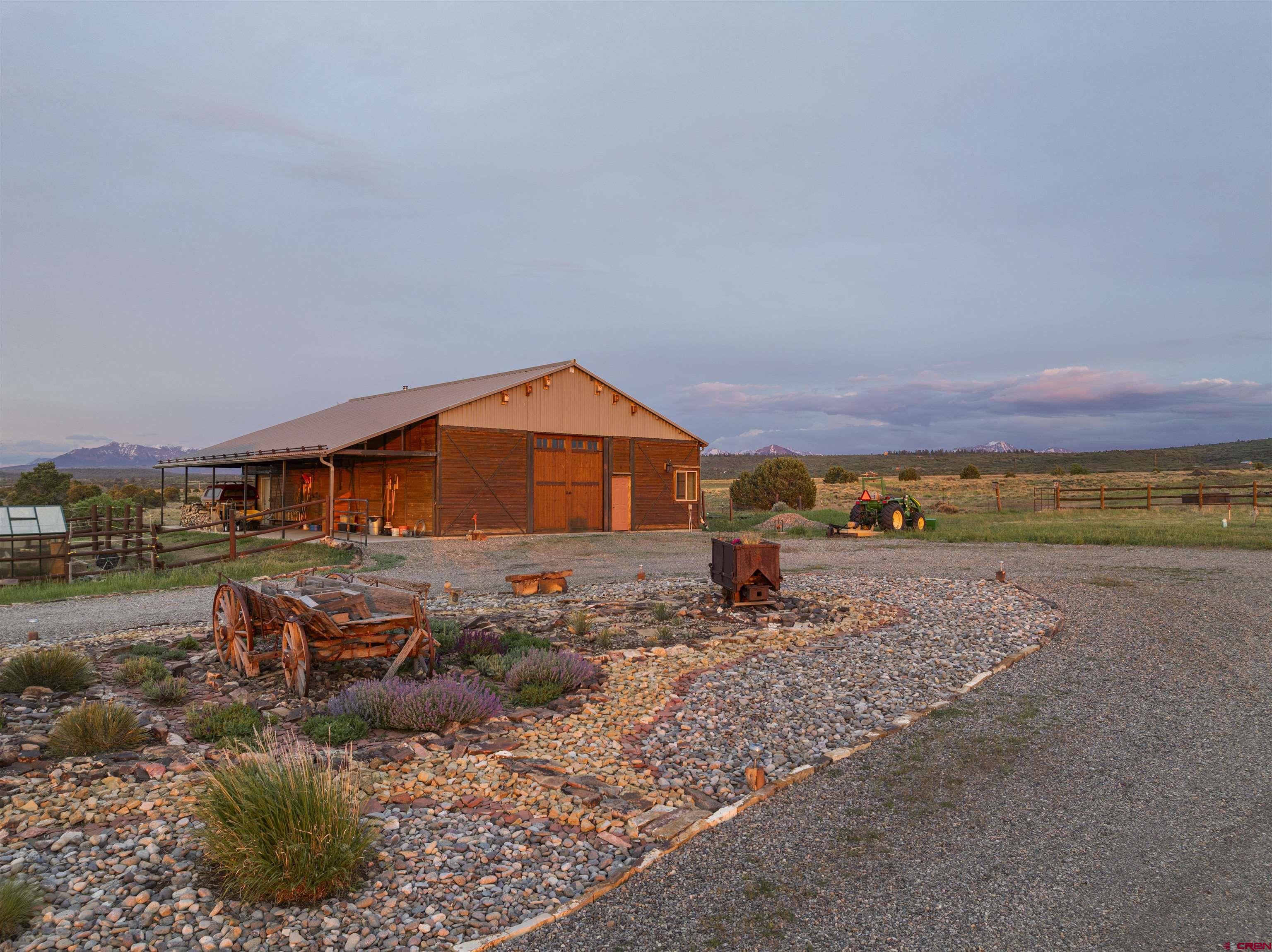 3100 South 44zs Road Norwood, CO 81423 - Photo 13 of 45 a view of a house with a yard