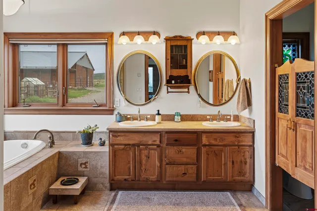 a view of bathroom with dual sinks