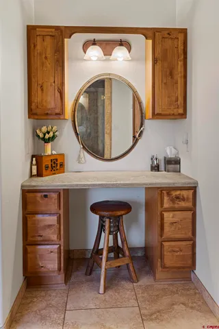a bathroom with a sink a mirror and a toilet