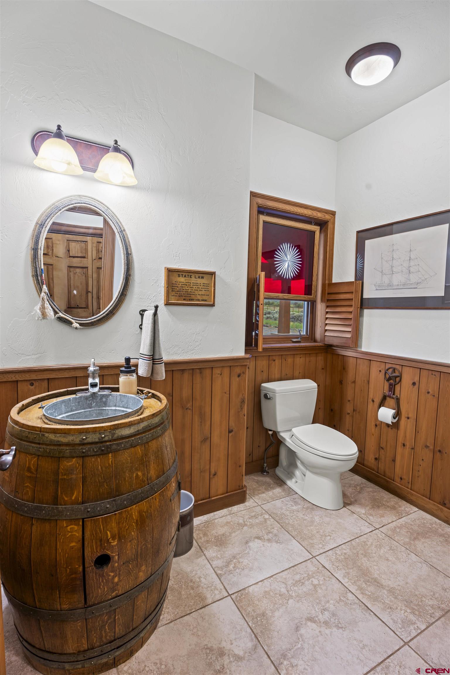 3100 South 44zs Road Norwood, CO 81423 - Photo 24 of 45 a room with a mirror and painting on the wall