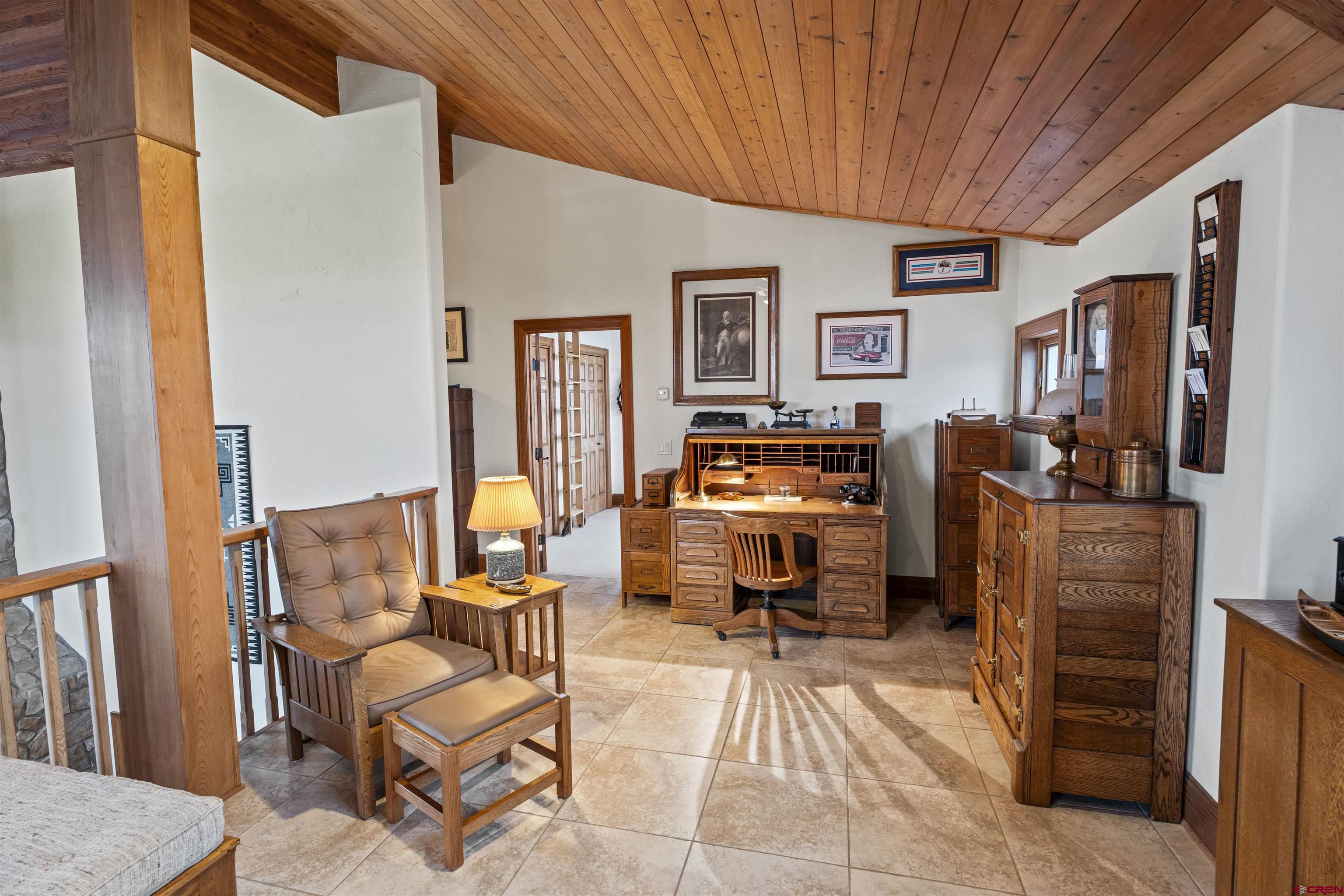 3100 South 44zs Road Norwood, CO 81423 - Photo 27 of 45 a living room with furniture and a flat screen tv