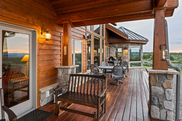 a view of balcony with couch and wooden floor