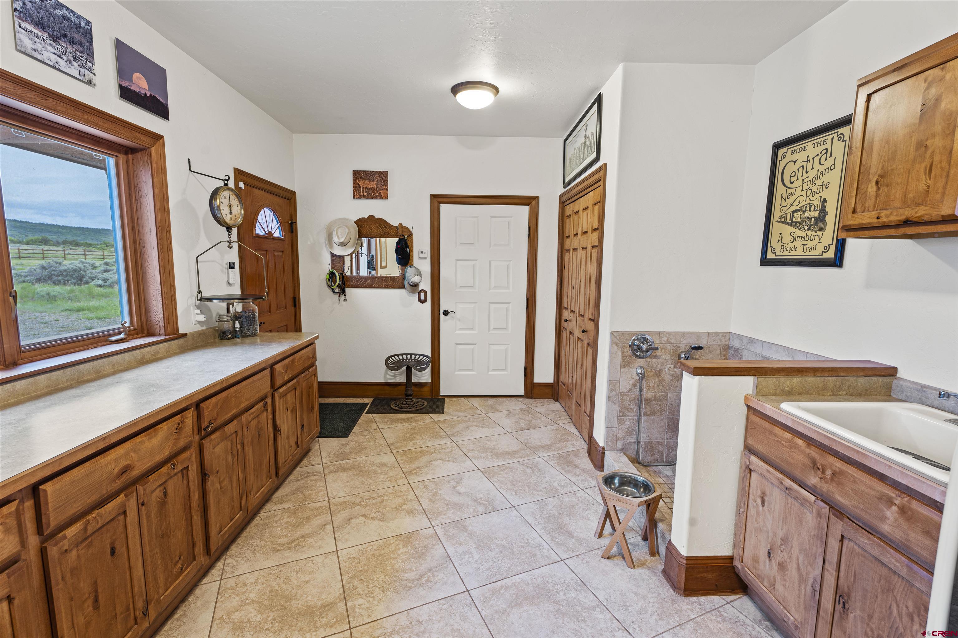 3100 South 44zs Road Norwood, CO 81423 - Photo 34 of 45 a view of a kitchen with fridge and workspace
