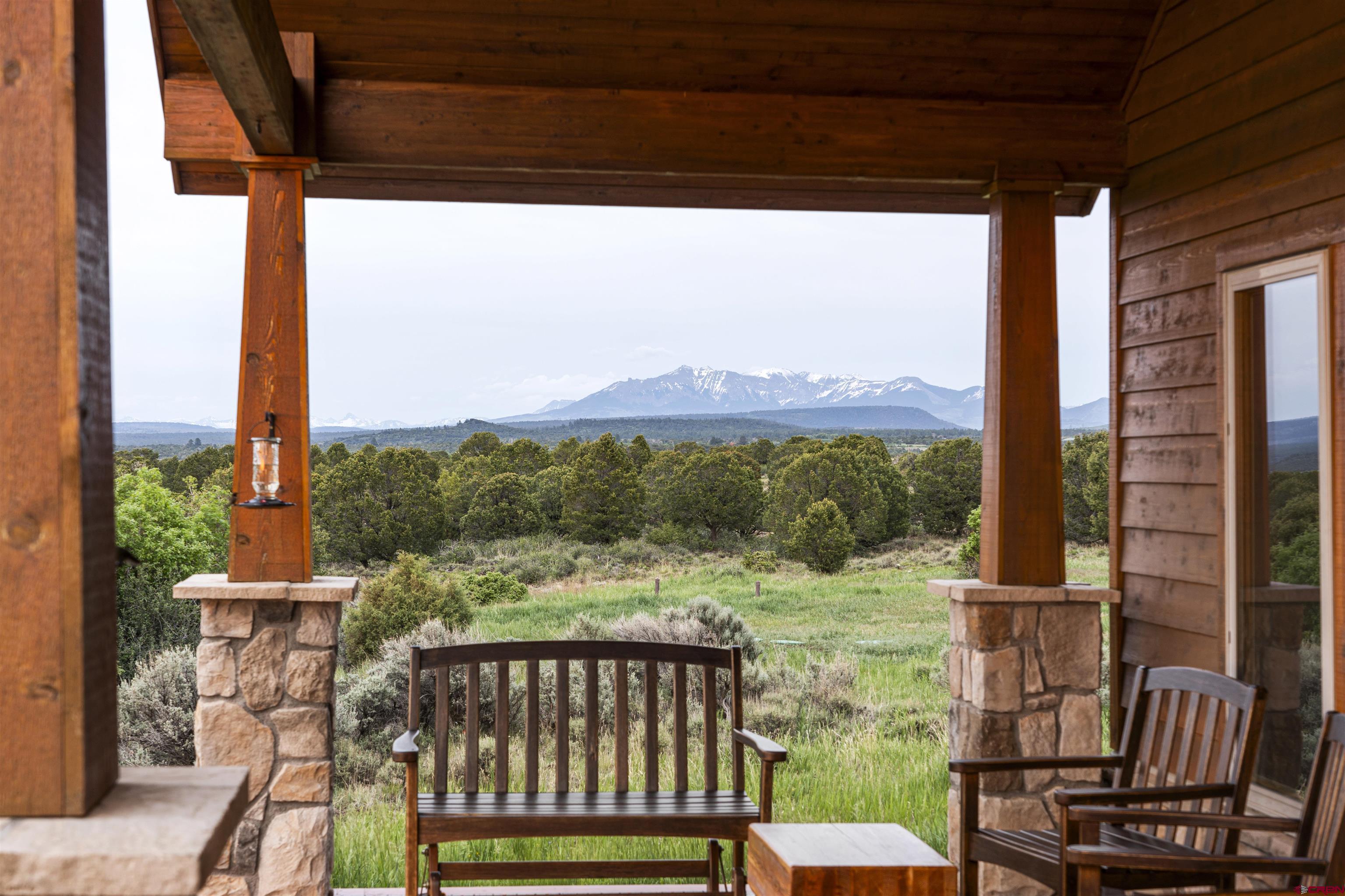 3100 South 44zs Road Norwood, CO 81423 - Photo 35 of 45 a view of a chair and table in the balcony