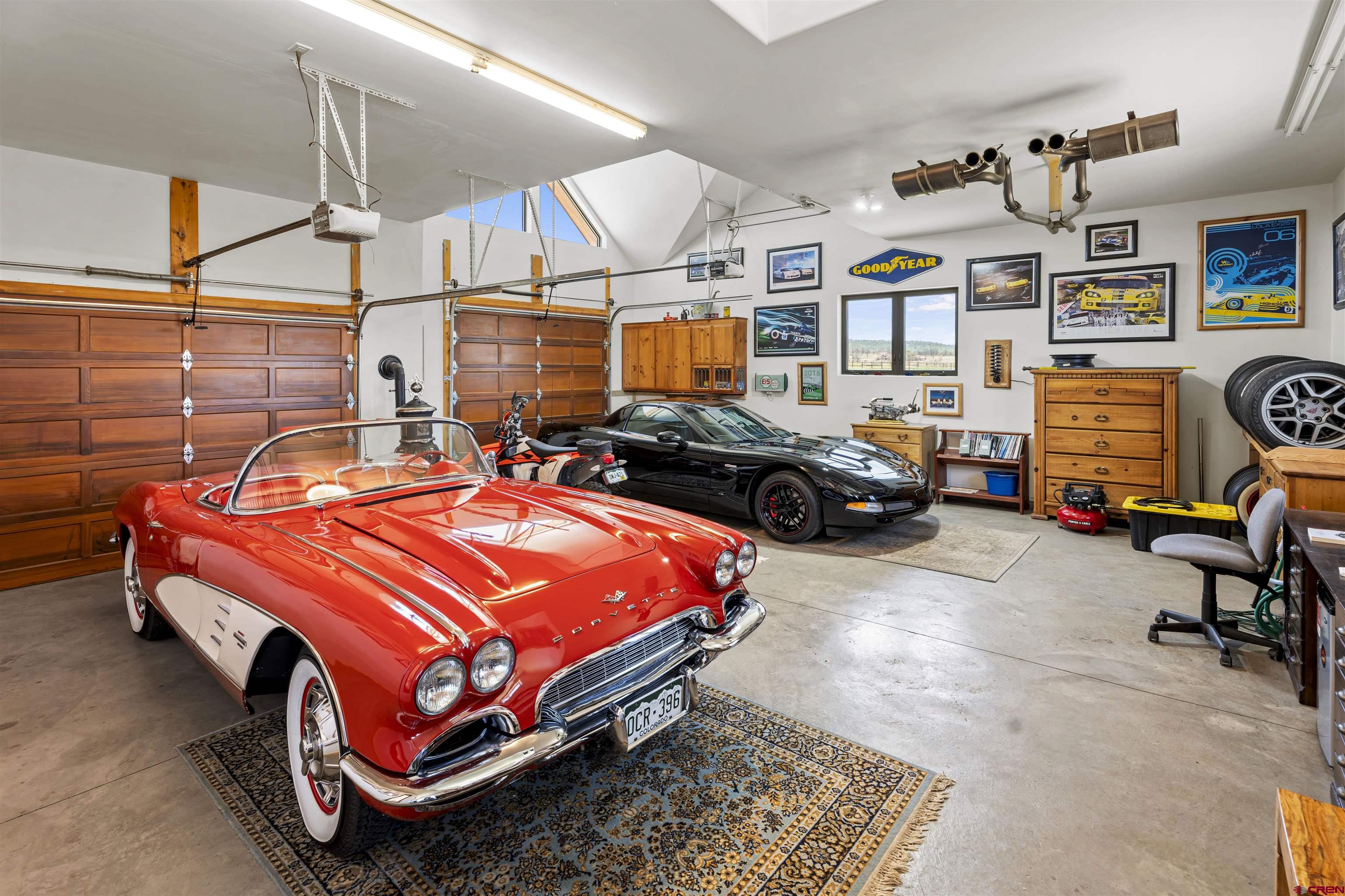 3100 South 44zs Road Norwood, CO 81423 - Photo 37 of 45 a bedroom with bed and a chandelier