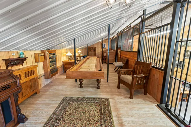 a sitting area with furniture and wooden floor