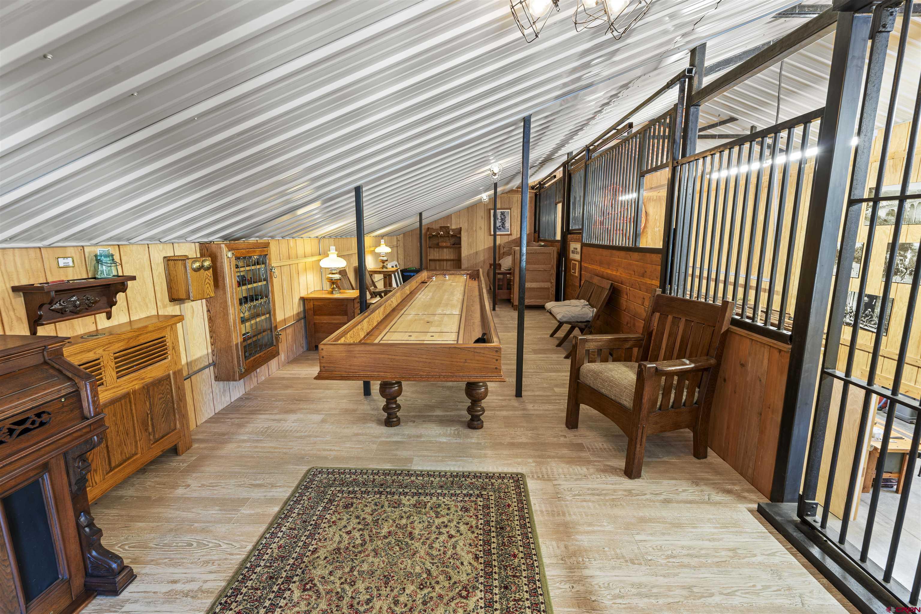 3100 South 44zs Road Norwood, CO 81423 - Photo 40 of 45 a sitting area with furniture and wooden floor