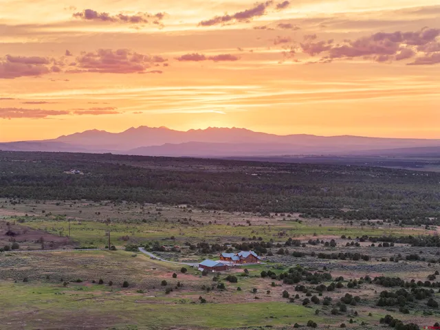 a view of a big yard with mountain