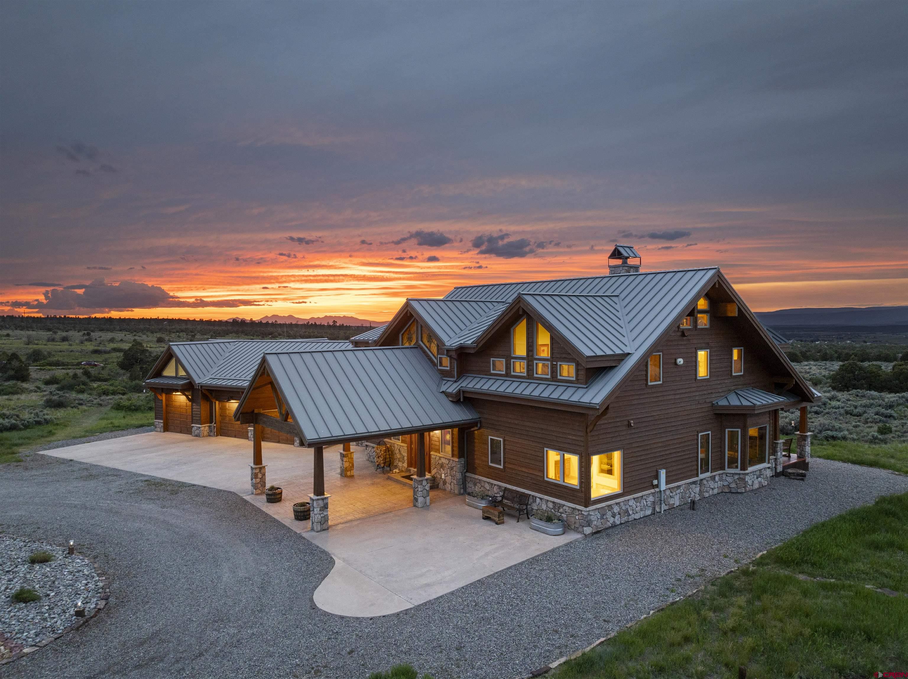 3100 South 44zs Road Norwood, CO 81423 - Photo 9 of 45 a view of a house with pool and chairs