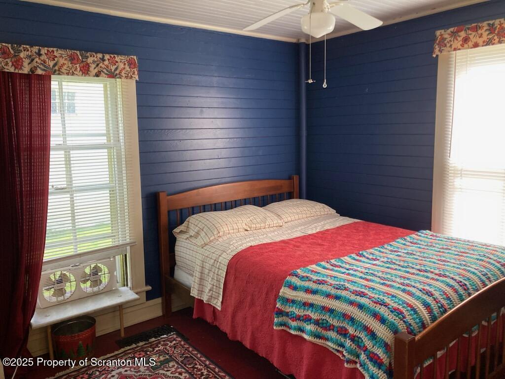 700 West Main Street Susquehanna, PA 18847 - Photo 36 of 43 a bedroom with a bed and a chandelier