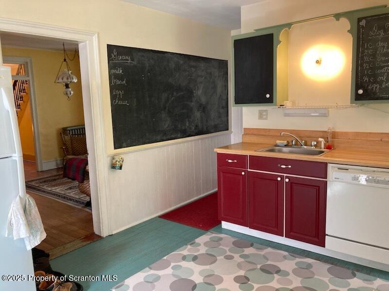 700 West Main Street Susquehanna, PA 18847 - Photo 9 of 43 a kitchen with stainless steel appliances granite countertop a sink and a microwave