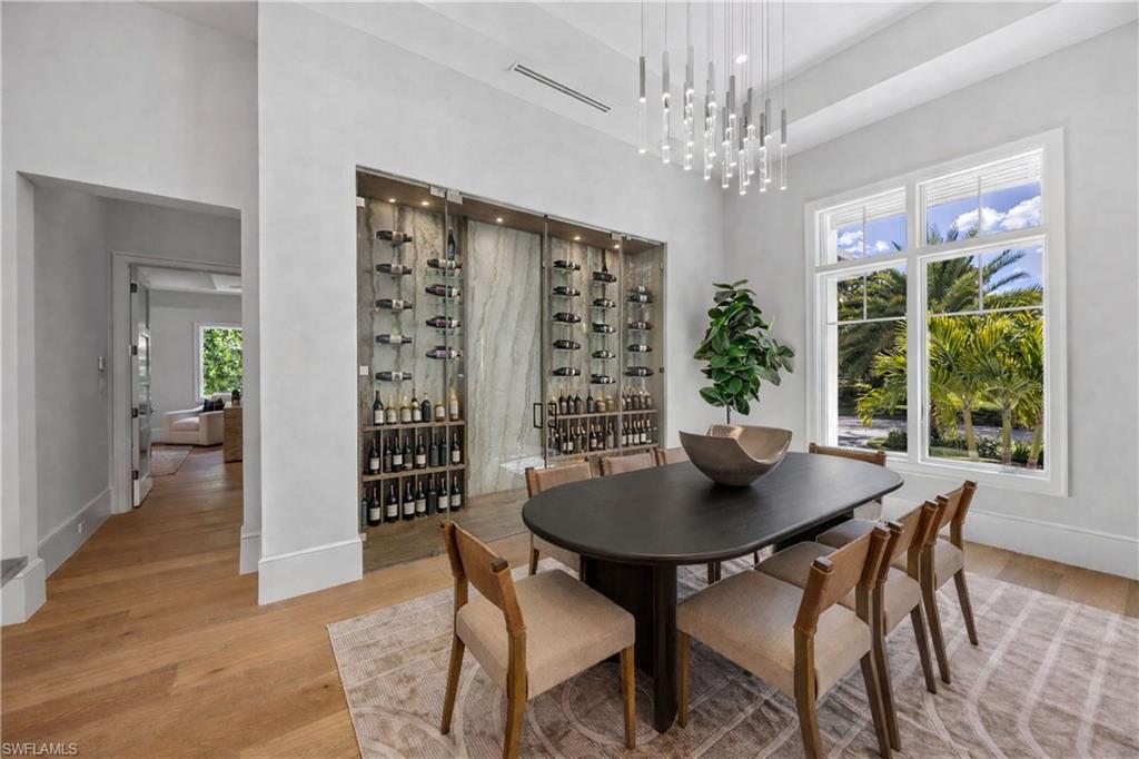 375 Bow Line Drive Naples, FL 34103 - Photo 9 of 48 Dining Room, Virtually Staged Wine Wall