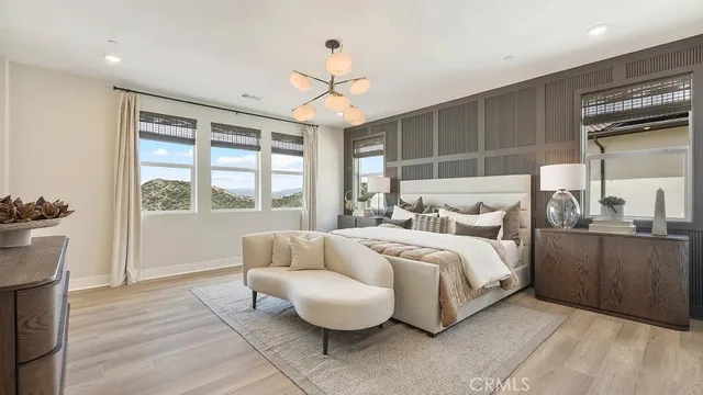 a spacious bedroom with a bed and a window