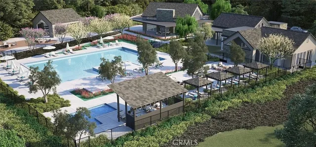 a view of a garden with a fountain and a tree