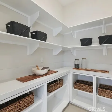 a kitchen with a stove and a refrigerator