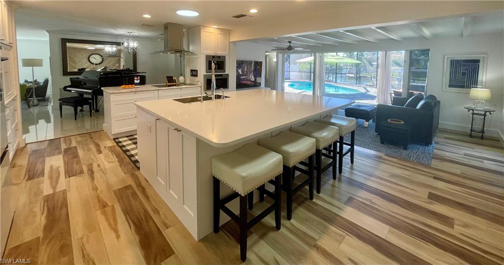 2120 Sandpiper Street Naples, FL 34102 - Photo 48 of 48 Open floorplan transitions to lanai.