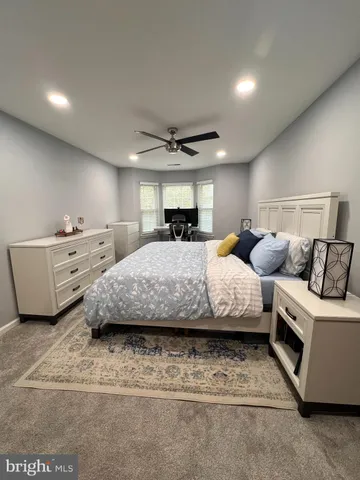 a bedroom with bed and window