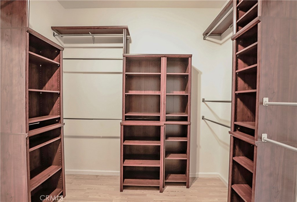 1653 Honors Circle Corona, CA 92883 - Photo 14 of 35 a view of walk in closet with empty racks