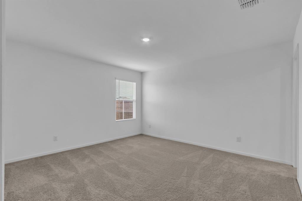 11325 Rodeo Drive Providence Village, TX 76227 - Photo 16 of 40 a view of an empty room with a window