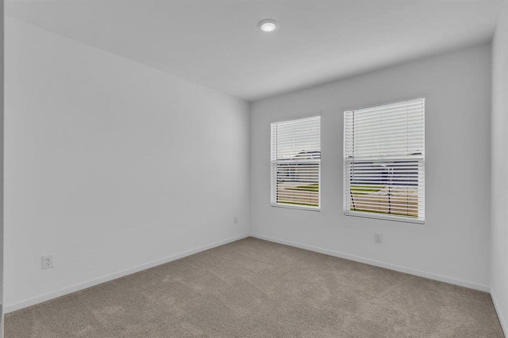 11325 Rodeo Drive Providence Village, TX 76227 - Photo 19 of 40 an empty room with a window