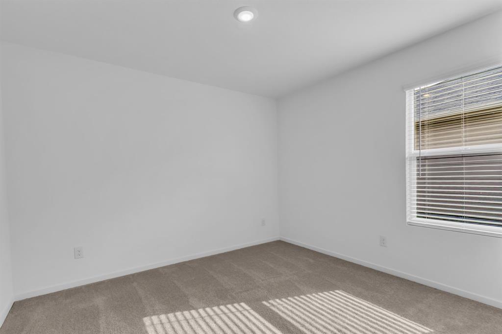 11325 Rodeo Drive Providence Village, TX 76227 - Photo 20 of 40 a view of an empty room and a window