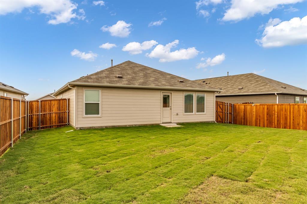 11325 Rodeo Drive Providence Village, TX 76227 - Photo 24 of 40 a view of a backyard of the house