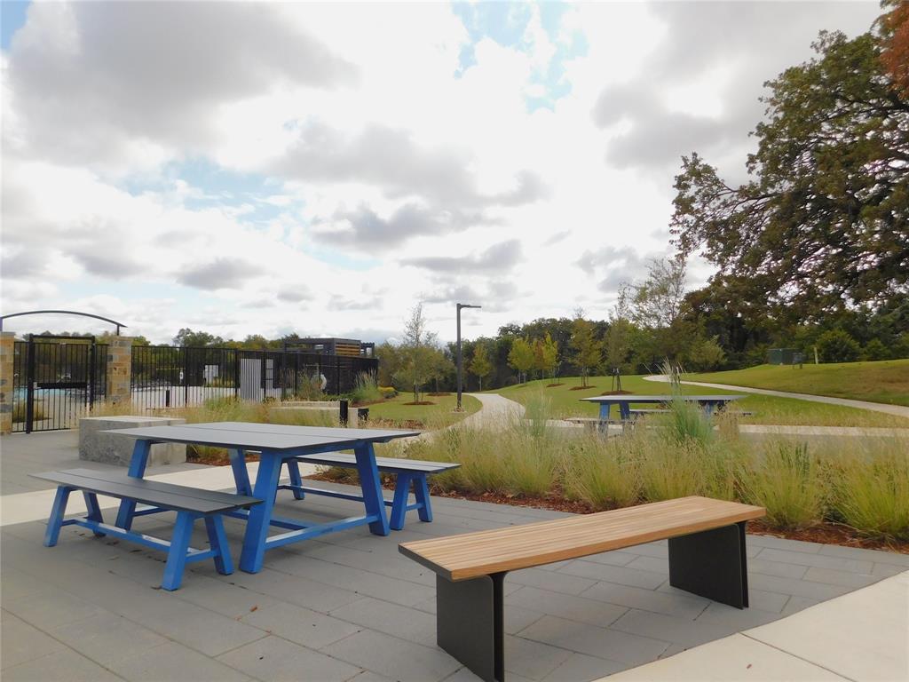 11325 Rodeo Drive Providence Village, TX 76227 - Photo 34 of 40 a view of a lake with table and chairs