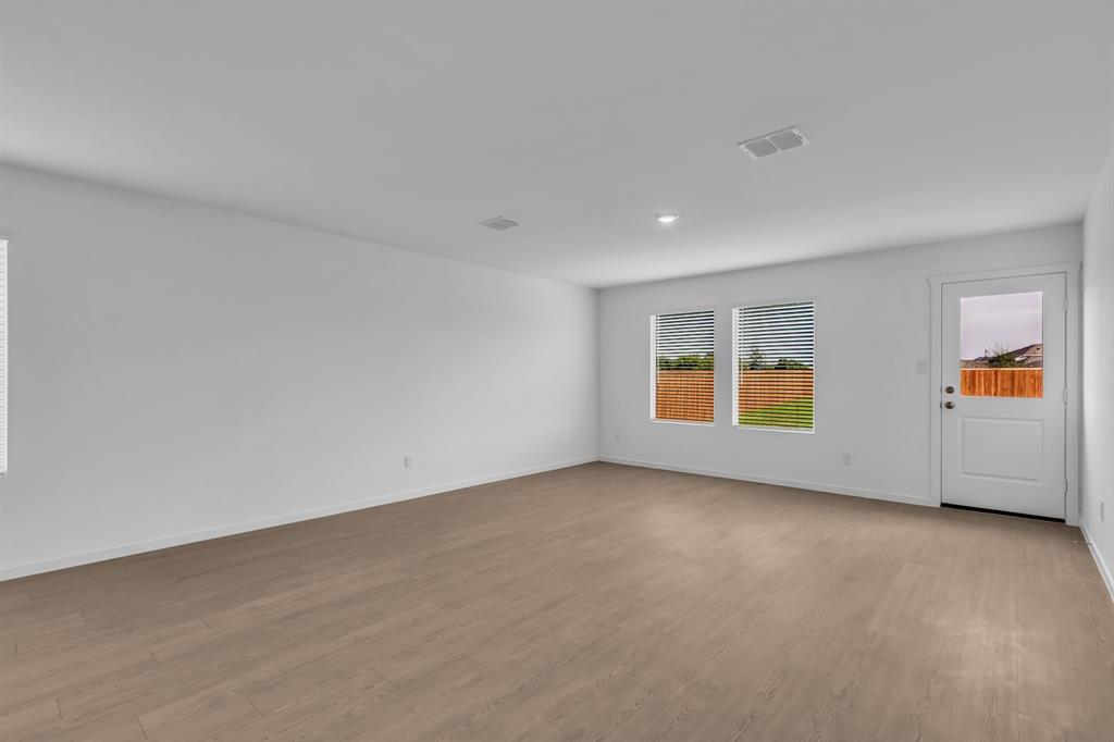 11325 Rodeo Drive Providence Village, TX 76227 - Photo 7 of 40 an empty room with windows