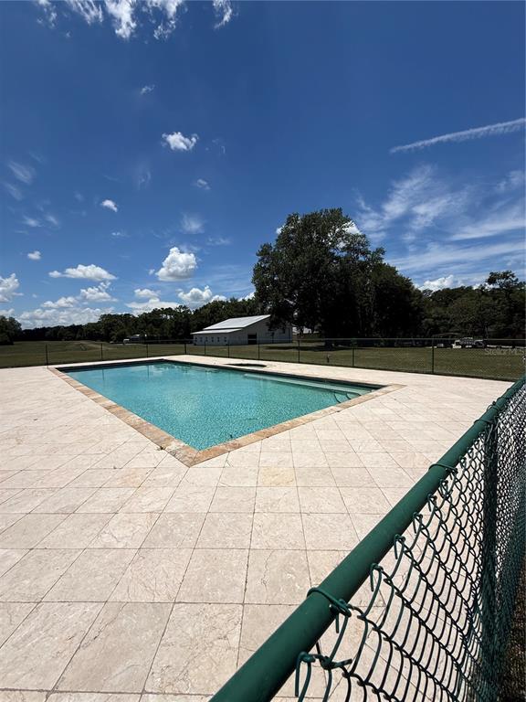 7390 South Mc Alpin Road McAlpin, FL 32062 - Photo 37 of 53 a view of swimming pool with outdoor seating and plants